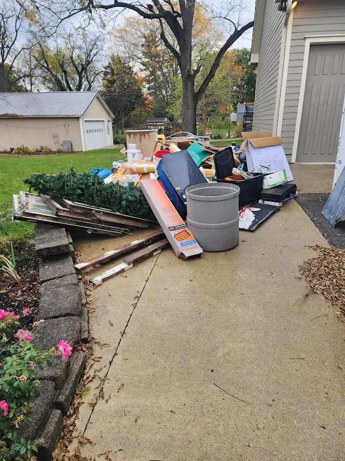 Dumpster being loaded with debris for Residential Dumpster Rental in Gardner